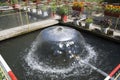 A water feature in fish pond in sunny day Royalty Free Stock Photo