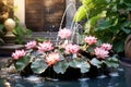 a water feature with floating lotus flowers in a patio setting Royalty Free Stock Photo