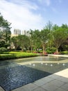 water features in an open, paved walkway near a fountain