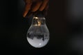 Water fill into filament bulb and glow yellow light