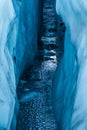 Water filled crevasse reflecting the sky from deep within the Matanuska Glacier Royalty Free Stock Photo