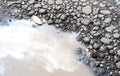 Water Filled Pothole in the Road Royalty Free Stock Photo