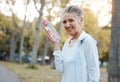 Water, fitness and park with a senior woman holding a bottle during an exercise or workout for a healthy lifestyle Royalty Free Stock Photo