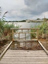 Water Floods a Dock, Kingsland Creek, Hackensack River, Meadowlands, NJ, USA Royalty Free Stock Photo