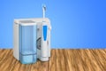 Water flosser, dental oral irrigator on the wooden table. 3D rendering Royalty Free Stock Photo