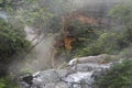 Water flow over the ledge at misty Wentworth Falls