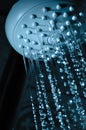 Water flowing out of shower in dark Royalty Free Stock Photo