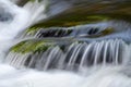 Water flowing over a rock in a river Royalty Free Stock Photo