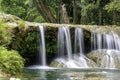 The water flowing over rocks and trees down a waterfall at Kapao waterfall National Park ,Chumphon in Thailand