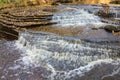 Water flowing over the shale rock in the river Royalty Free Stock Photo