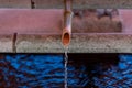 Water Flowing into a pool from Bamboo Pipe Royalty Free Stock Photo