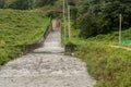 Water flowing rapidly down spillway into small river Royalty Free Stock Photo