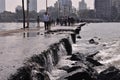 Water flowing into the shore and hitting big rocks Royalty Free Stock Photo