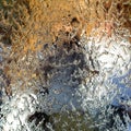 Water flows along the wall of the mirror, horizontal abstract texture, shiny background Royalty Free Stock Photo