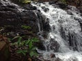 Water flows from a height through rock crevices