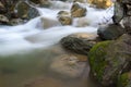 Water flows over mossy rocks Royalty Free Stock Photo