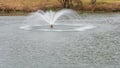 Water fountain in center of a pond