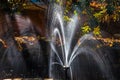 Water fountain closeup in a garden in autumn.