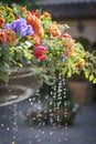 Water fountain with colorful flowers including roses and tulips decorated for a wedding even