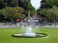 The water fountain, front lawn and tourists outside of the independence palace Saigon