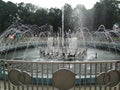 water fountain with iron fence aorund in the middle of park Royalty Free Stock Photo