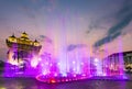 Water fountain and multi colored lightshow, at sunset,next to Patuxai monument in Vientiane, Laos