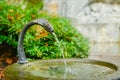 Water fountain near memorial of dying lion in Lucerne, Switzerland Royalty Free Stock Photo