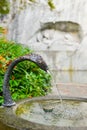 Water fountain near memorial of dying lion in Lucerne, Switzerland Royalty Free Stock Photo