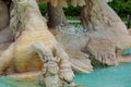 Water fountain in park. Splashing streams of in stream pouring from . on surface lake. in summer . Royalty Free Stock Photo