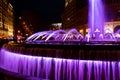 Water fountain in purple color in celebration of 8 march international woman`s day in barcelona, spain