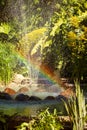 A water fountain with a rainbow in the air Royalty Free Stock Photo