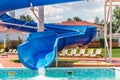 Water fun in the pool, slide. Concept, cheerful, perky bright colorful summer and relaxation. View from above