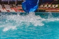 Water fun in the pool, slide. Concept, cheerful, perky bright colorful summer and relaxation. View from above Royalty Free Stock Photo