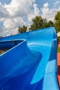 Water fun in the pool, slide. Concept, cheerful, perky bright colorful summer and relaxation. View from above Royalty Free Stock Photo