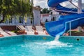 Water fun in the pool, slide. Concept, cheerful, perky bright colorful summer and relaxation. View from above