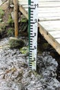 Water gauge in a mountain stream Royalty Free Stock Photo