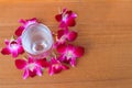 Water glass cool with orchid purple on wooden floor board with copy space add text