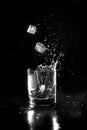 Water on glass with splash on black background. Royalty Free Stock Photo