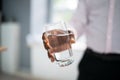 Water Glass And Tremble Hands Royalty Free Stock Photo