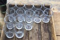 Water glasses in a wooden crate Royalty Free Stock Photo