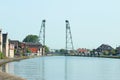 Water of the Gouwe Canal with in the background the green steel vertical lift bridge of Waddinxveen in the Netherlands