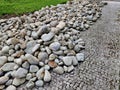 water-ground stones transported by river to site. washed out stone Royalty Free Stock Photo