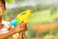 Water gun close up in hands of a little boy Royalty Free Stock Photo