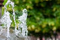 Water gurgling from a street fountain. A splash of water in a fountain, an abstract image Royalty Free Stock Photo