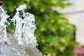 Water gurgling from a street fountain. A splash of water in a fountain, an abstract image Royalty Free Stock Photo