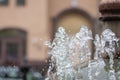 Water gurgling from a street fountain. A splash of water in a fountain, an abstract image Royalty Free Stock Photo