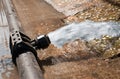 Water gushing out of the pipeline during construction Royalty Free Stock Photo