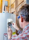 Water heater maintenance Royalty Free Stock Photo