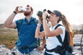 Water, hiking and couple trekking in the mountains for travel, peace and adventure during summer. Thirsty, tired and Royalty Free Stock Photo