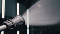 Water hose car washing close up. Worker man watering with foam auto out of manually high pressure hose jet in car wash Royalty Free Stock Photo